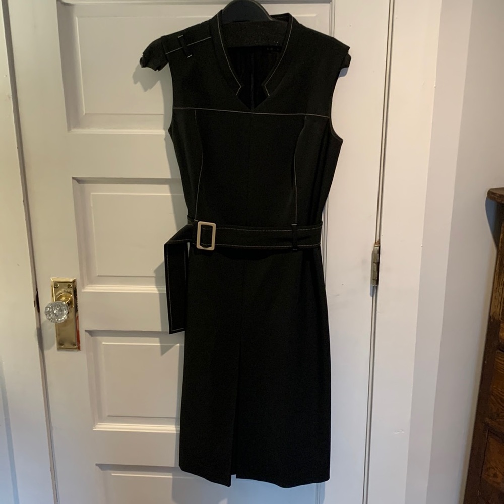 Black structured dress with belt and exposed stitching detail